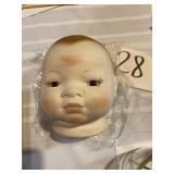 Porcelain babies head with painted eyes