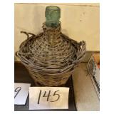 Old wine bottle in a basket