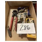 Sorted tools, knife, scissors, level wire cutters