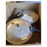 Two pressure cookers, and foldable travel iron