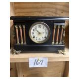 Vintage mantle clock with pendulum and key