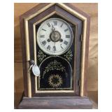 Mantle clock with key and pendulum provided
