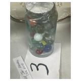 Old jar with marbles