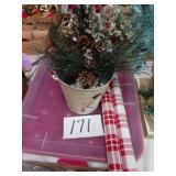 Christmas bucket with pine tree and wrapping paper