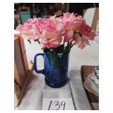 Blue pitcher with fake flowers