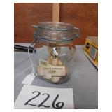Glass jar with clasp and world