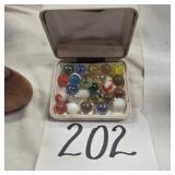 Assorted marbles in vintage jc Penney case