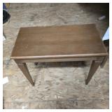 Vintage piano bench opens for storage