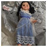Vintage doll in blue dress as is creepy eyes