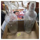 Lot of 2 tall glass bottles