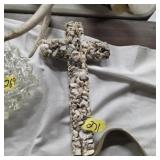 Cross made out of small rocks gravel