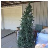 7 foot Christmas tree with lights and decorations