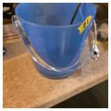 Blue ice bucket with utensils