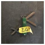 Small green Swiss army style knife