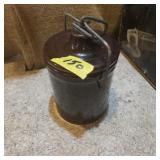 Brown glazed crock with metal handle