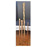 One Cane and Three Walking Sticks