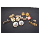 Assortment of cufflinks and tie tacks