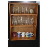 Three shelf bookcase with cups/glasses