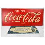 two Coca-Cola Signs