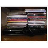 DVD Player with a stack of CDs