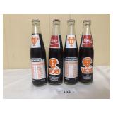 4 1985 Coke Bottles