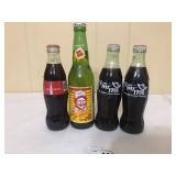 3 Coke Bottles, One Sundrop Bottle