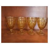 Four Amber Pressed Glass Goblets
