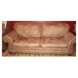 Brown Sofa with Nail Head Trim and Rolled Arms