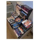 Collection of Assorted VHS Tapes and DVDs