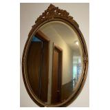 Oval Gilt Wall Mirror With Decorative Frame