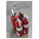 Four Red Fire Extinguishers with Hoses