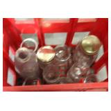 Red Coca-Cola Crate with Assorted Glass Bottles
