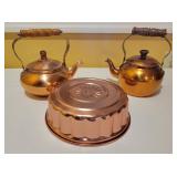 Copper Mold and Two Copper-Toned Teapots Copper Mold and Two Copper-Toned Teapots