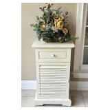 White Pier One Shelf With a Floral Arrangement