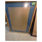 Brown frame with blue matte.