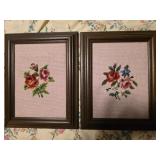 Two needle point flowers in a frame