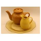 Brown Ceramic Teapot, Yellow Pitcher, and Plate