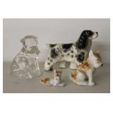 Four Dog Figurines in Various Materials