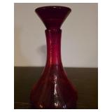 A smaller red stained glass decanter