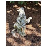 Two Decorative Garden Statues Featuring Musicians