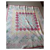 Patchwork Quilt with Pink Border