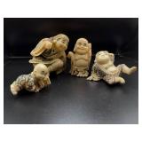 Four Oriental-Style Figurines in Varying Poses