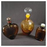 Three Amber Glass Bottles