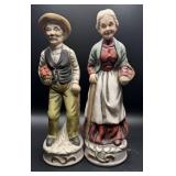 Collectible figurines of an elderly farmer couple