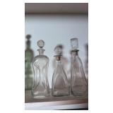 Three Glass Decanters with Stoppers