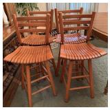 4 Vintage wooden slat back swivel bar stool.