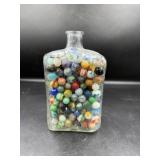 Glass Bottle Filled With Assorted Marbles