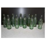 Lot of 10 Vtg Green Coca Cola Embossed Bottles