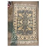 Woven Rug with Fringe Detailing