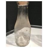 Four Vintage Dairy Bottles